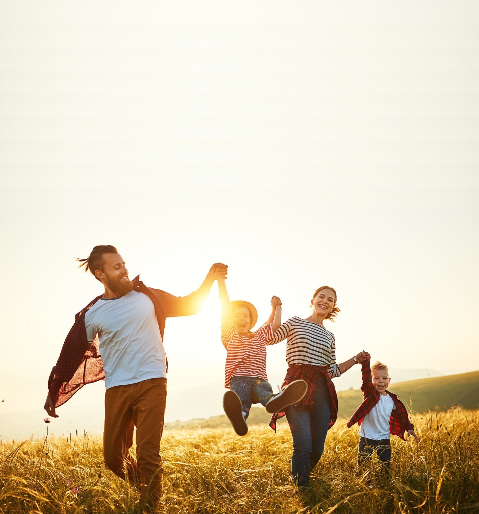 Family in field background