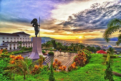 Martha Christina Tiahahu statue overlooking Ambon Bay at sunset